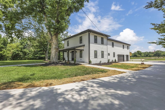 10123 Loop Rd, Millersport, OH 43046 - view of front facade featuring an attached garage, driveway, and a front lawn
