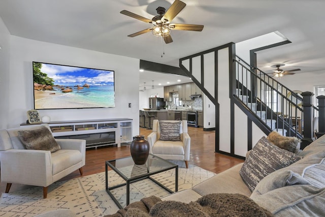 10123 Loop Rd, Millersport, OH 43046 - living area featuring a ceiling fan, wood finished floors, and stairs
