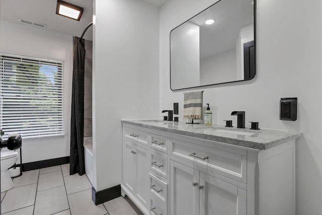 10123 Loop Rd, Millersport, OH 43046 - bathroom featuring double vanity, tile patterned floors, and shower / bathtub combination with curtain