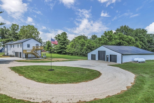 10123 Loop Rd, Millersport, OH 43046 - view of property's community with a lawn, a garage, an outbuilding, and stairway