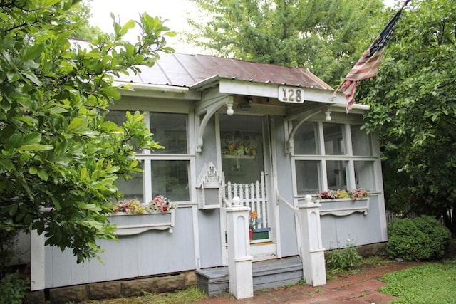 128 Gilead St, Cardington, OH 43315 - view of front facade featuring a sunroom