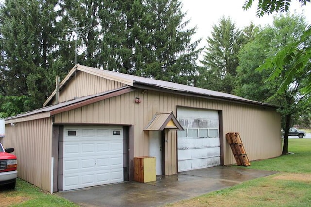 128 Gilead St, Cardington, OH 43315 - view of front of house featuring a garage, an outbuilding, and a metal roof