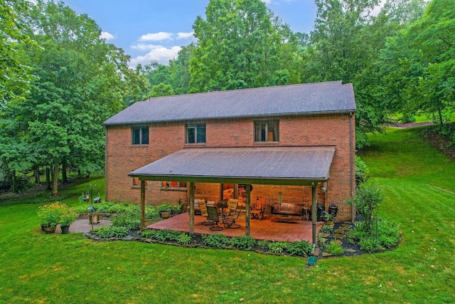 976 Hillside Dr, Newark, OH 43055 - back of house with a lawn, a patio area, and brick siding