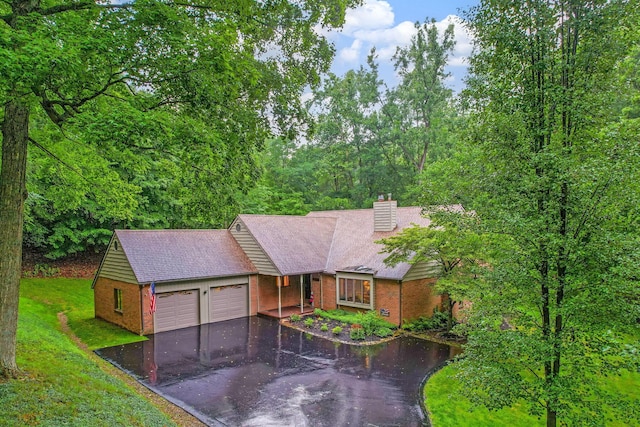 976 Hillside Dr, Newark, OH 43055 - single story home featuring brick siding, asphalt driveway, an attached garage, a chimney, and a front yard