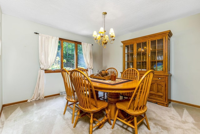 976 Hillside Dr, Newark, OH 43055 - dining area with a chandelier, light carpet, and a textured ceiling