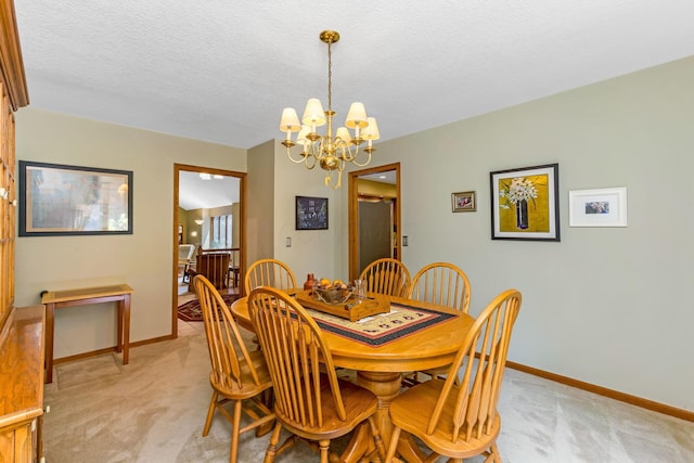 976 Hillside Dr, Newark, OH 43055 - dining area featuring a chandelier, light colored carpet, and a textured ceiling