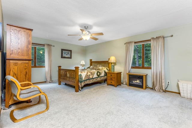 976 Hillside Dr, Newark, OH 43055 - carpeted bedroom with baseboards and a ceiling fan