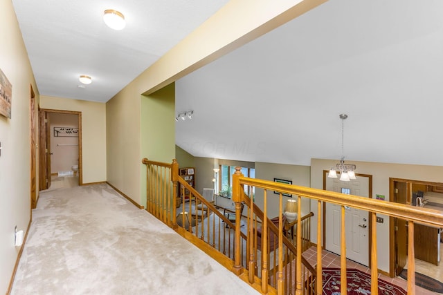 976 Hillside Dr, Newark, OH 43055 - hall with an upstairs landing, carpet floors, and a chandelier