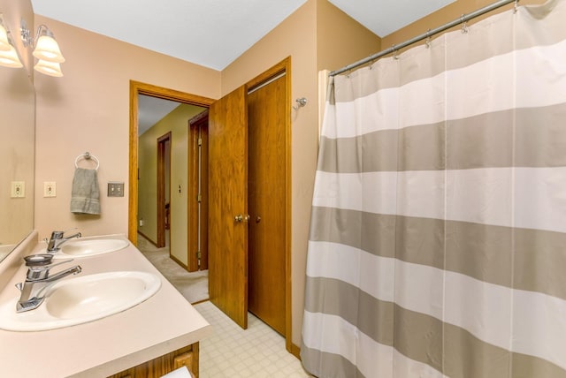 976 Hillside Dr, Newark, OH 43055 - full bathroom featuring double vanity, tile patterned floors, and a shower with curtain