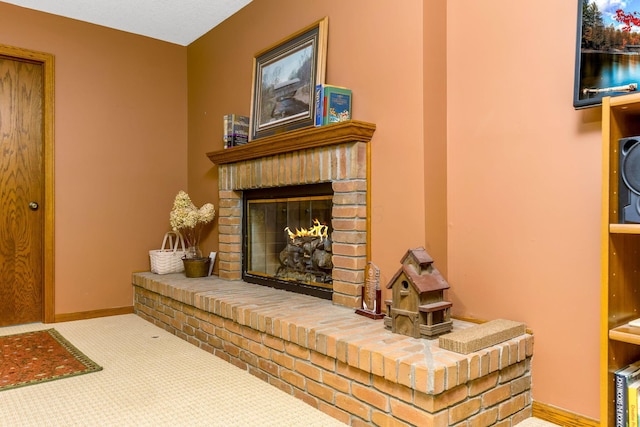 976 Hillside Dr, Newark, OH 43055 - living area featuring a brick fireplace and carpet flooring