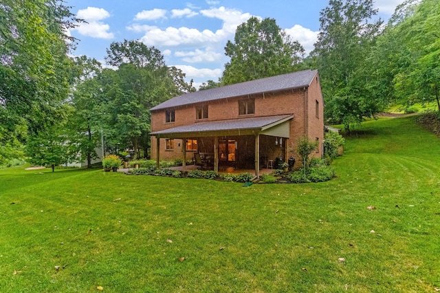 976 Hillside Dr, Newark, OH 43055 - rear view of house with a lawn, a patio, and brick siding