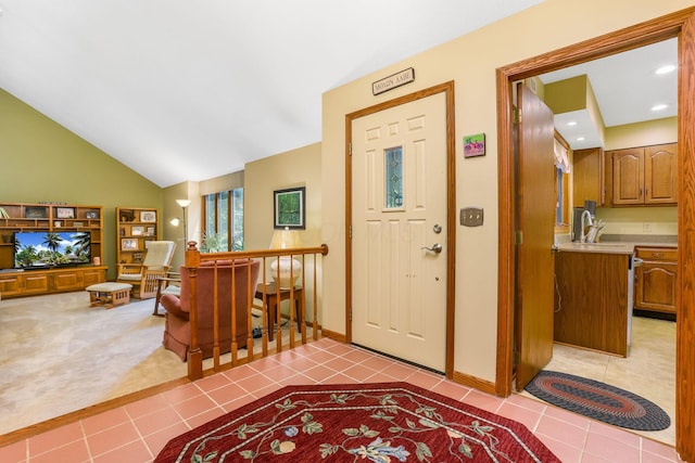 976 Hillside Dr, Newark, OH 43055 - carpeted entryway with tile patterned flooring and lofted ceiling