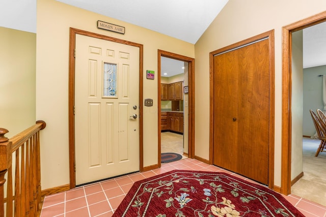 976 Hillside Dr, Newark, OH 43055 - tiled foyer entrance featuring baseboards and lofted ceiling