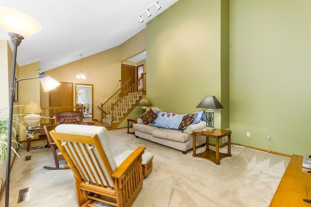 976 Hillside Dr, Newark, OH 43055 - living room with carpet, vaulted ceiling, and stairway