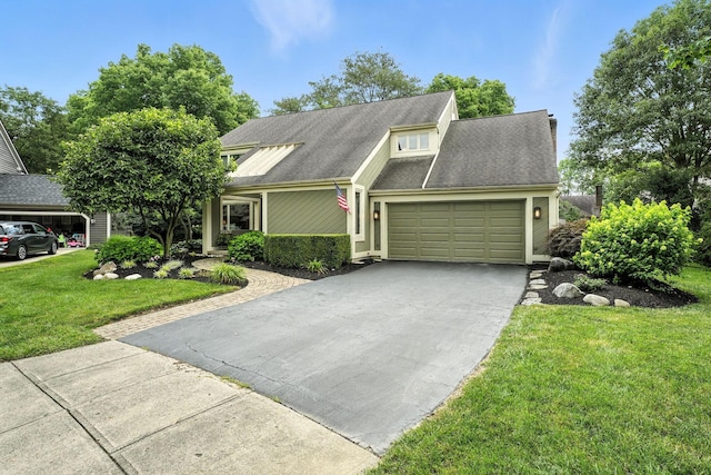 371 Ashworth Ct, Dublin, OH 43017 - view of front of property with concrete driveway, an attached garage, a front lawn, and roof with shingles