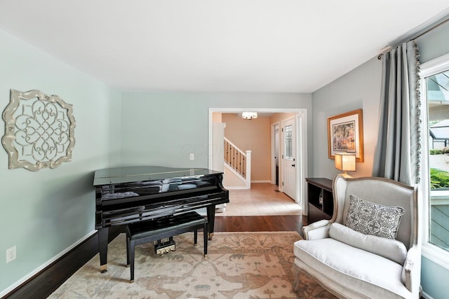 371 Ashworth Ct, Dublin, OH 43017 - sitting room featuring wood finished floors, stairs, and a chandelier