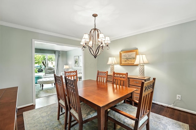 371 Ashworth Ct, Dublin, OH 43017 - dining area featuring a chandelier, crown molding, and dark wood-type flooring