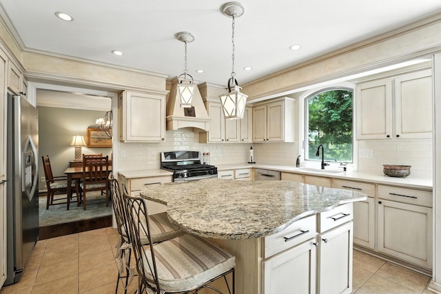 371 Ashworth Ct, Dublin, OH 43017 - kitchen with appliances with stainless steel finishes, custom range hood, light tile patterned flooring, decorative backsplash, and a center island