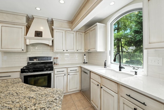 371 Ashworth Ct, Dublin, OH 43017 - kitchen with appliances with stainless steel finishes, custom exhaust hood, recessed lighting, backsplash, and light stone countertops