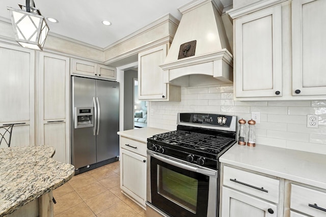 371 Ashworth Ct, Dublin, OH 43017 - kitchen featuring stainless steel appliances, premium range hood, decorative backsplash, light tile patterned flooring, and recessed lighting