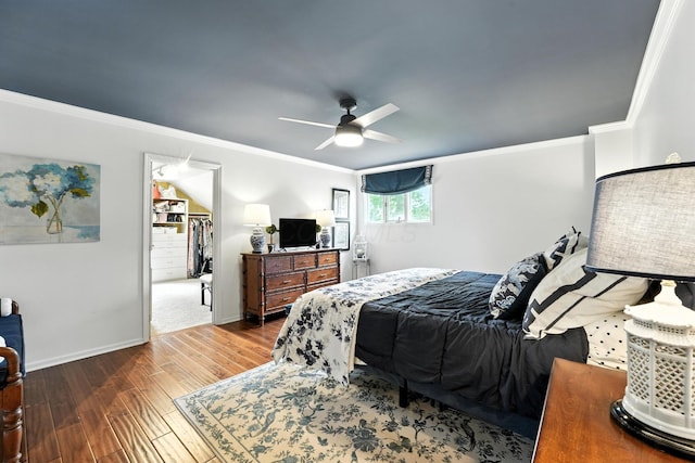 371 Ashworth Ct, Dublin, OH 43017 - bedroom featuring wood finished floors, crown molding, ceiling fan, and a walk in closet