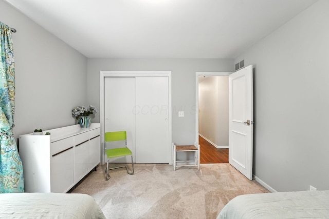 371 Ashworth Ct, Dublin, OH 43017 - bedroom featuring light carpet and a closet