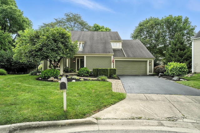 371 Ashworth Ct, Dublin, OH 43017 - view of front facade featuring asphalt driveway, a garage, a front yard, and roof with shingles