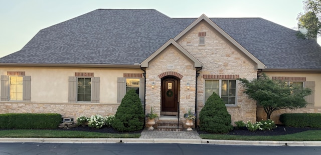 5849 Kingham Park, Dublin, OH 43017 - french country inspired facade with stone siding and a shingled roof