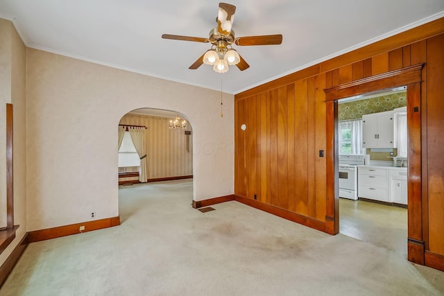 126 Dix Ave, Marion, OH 43302 - spare room with arched walkways, ceiling fan, crown molding, a chandelier, and carpet flooring