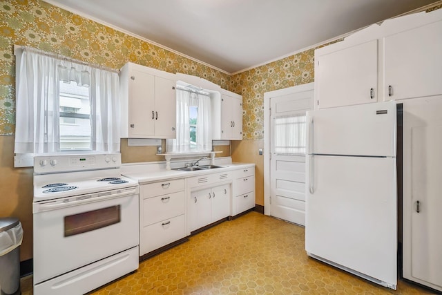 126 Dix Ave, Marion, OH 43302 - kitchen with wallpapered walls, white appliances, healthy amount of natural light, light floors, and light countertops