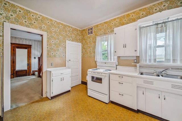 126 Dix Ave, Marion, OH 43302 - kitchen with wallpapered walls, electric range, light countertops, white cabinets, and ornamental molding