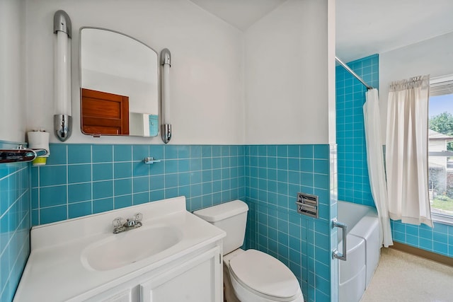 126 Dix Ave, Marion, OH 43302 - bathroom featuring healthy amount of natural light, shower / bathtub combination with curtain, vanity, tile walls, and a wainscoted wall