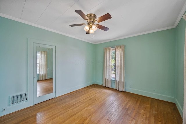 126 Dix Ave, Marion, OH 43302 - empty room with wood finished floors, crown molding, and a ceiling fan