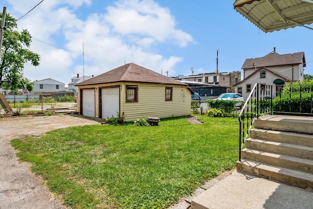 126 Dix Ave, Marion, OH 43302 - view of yard featuring a detached garage and an outbuilding