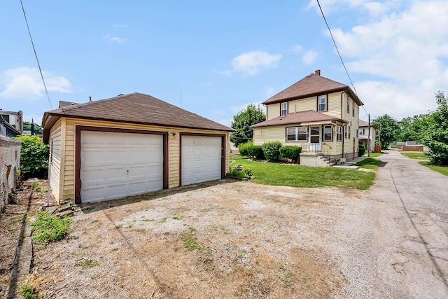 126 Dix Ave, Marion, OH 43302 - view of front facade with an outbuilding, a garage, and roof with shingles