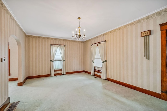 126 Dix Ave, Marion, OH 43302 - carpeted empty room with wallpapered walls, a chandelier, crown molding, and arched walkways