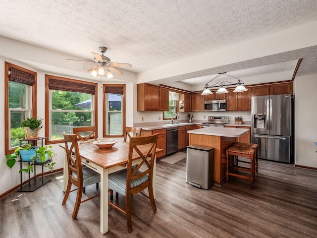 238 Key Blvd, Pataskala, OH 43062 - dining room featuring dark wood-style flooring, a textured ceiling, and a ceiling fan