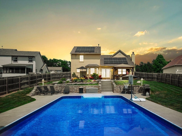 238 Key Blvd, Pataskala, OH 43062 - pool at dusk featuring a patio, a fenced backyard, and a gazebo