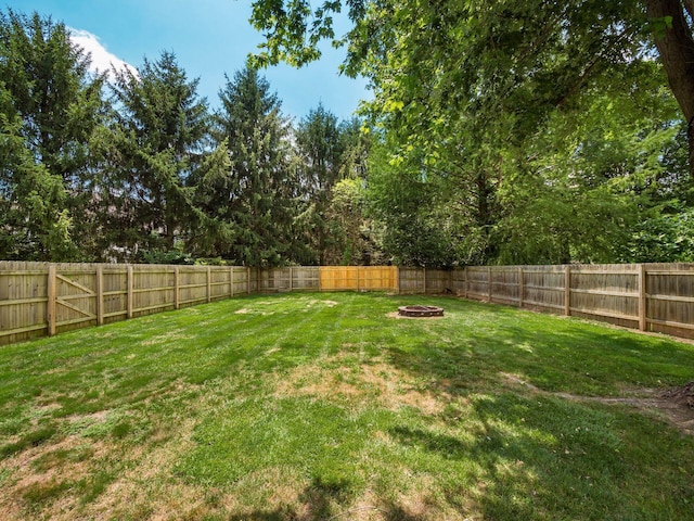 238 Key Blvd, Pataskala, OH 43062 - fenced backyard featuring a fire pit