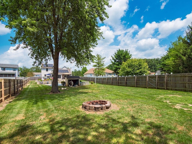 238 Key Blvd, Pataskala, OH 43062 - fenced backyard with an outdoor fire pit