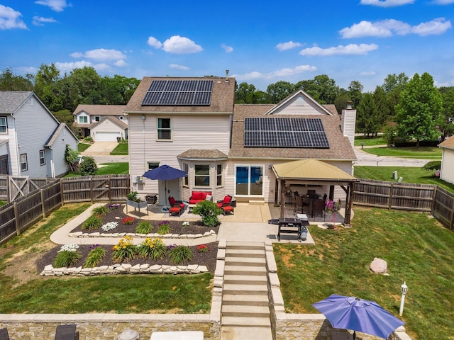 238 Key Blvd, Pataskala, OH 43062 - rear view of house with a patio area, solar panels, a fenced backyard, and a shingled roof