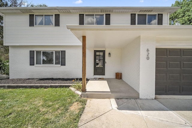 620 Fleetrun Ave, Columbus, OH 43230 - view of front facade with brick siding and driveway