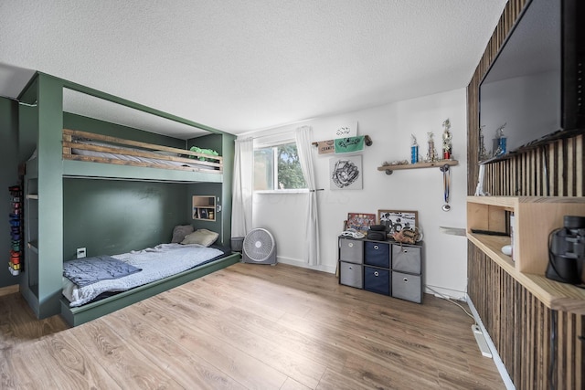 620 Fleetrun Ave, Columbus, OH 43230 - bedroom with a textured ceiling and wood finished floors