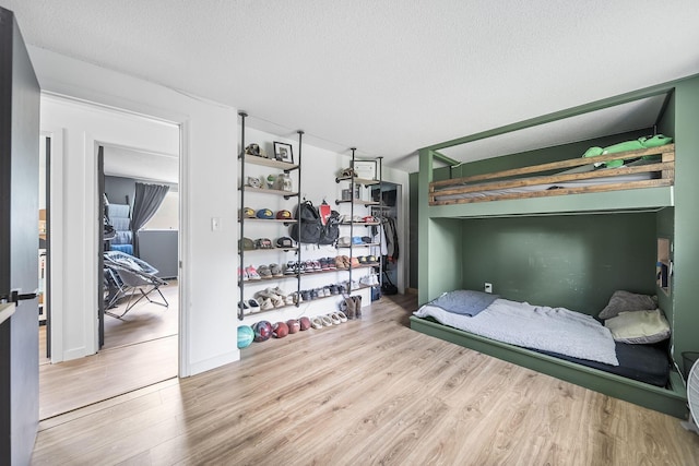 620 Fleetrun Ave, Columbus, OH 43230 - bedroom featuring wood finished floors and a textured ceiling