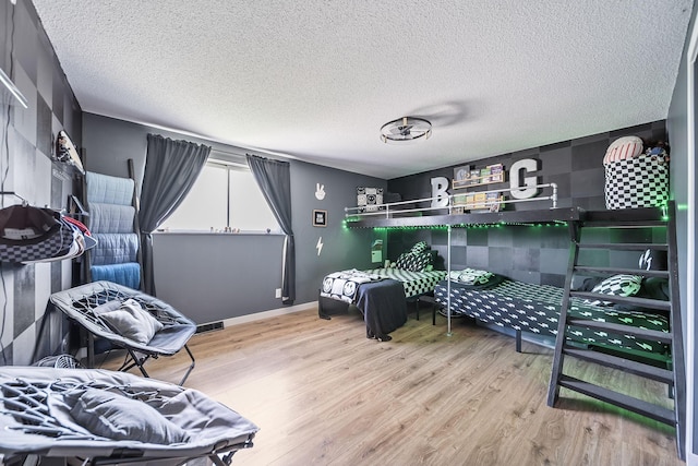 620 Fleetrun Ave, Columbus, OH 43230 - bedroom featuring light wood-style floors and a textured ceiling