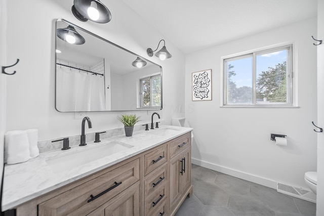 620 Fleetrun Ave, Columbus, OH 43230 - full bathroom with double vanity and tile patterned floors