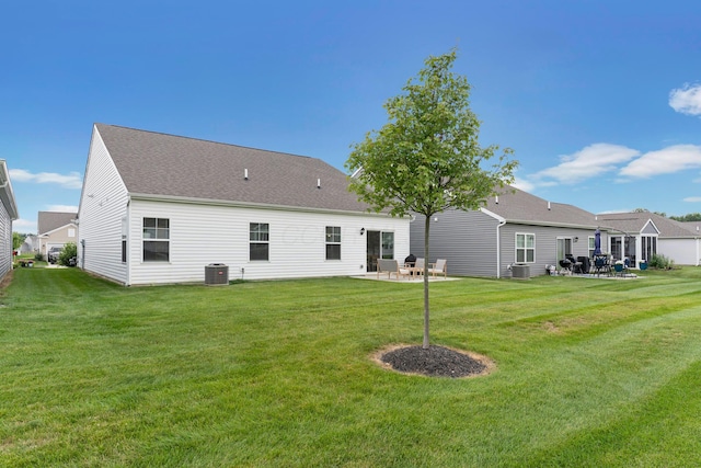 507 Curry Dr, Pataskala, OH 43062 - rear view of house with a patio, a yard, and a shingled roof
