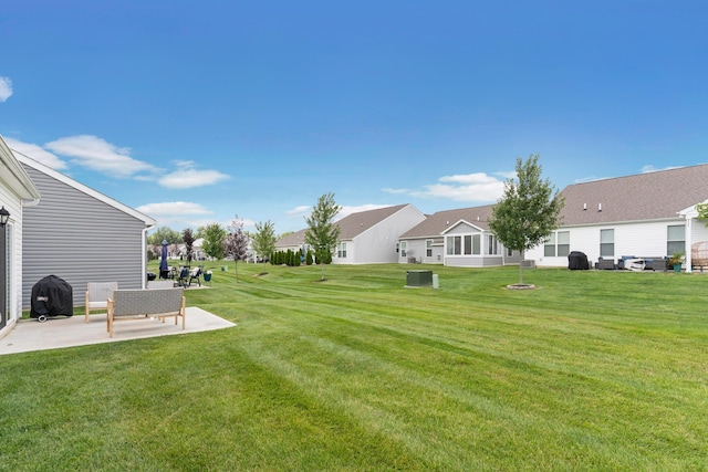 507 Curry Dr, Pataskala, OH 43062 - view of green lawn with a patio and a residential view