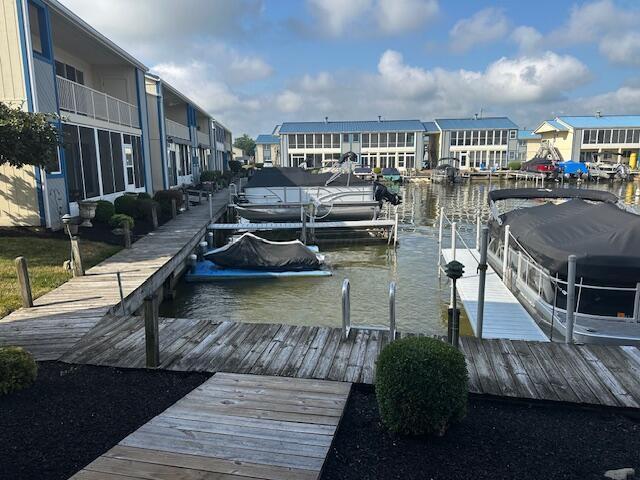 241 Chase Ave Unit B1L, Russells Point, OH 43348 - dock area featuring a residential view, boat lift, and a water view