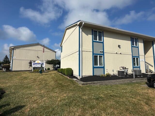 241 Chase Ave Unit B1L, Russells Point, OH 43348 - view of side of home with a lawn